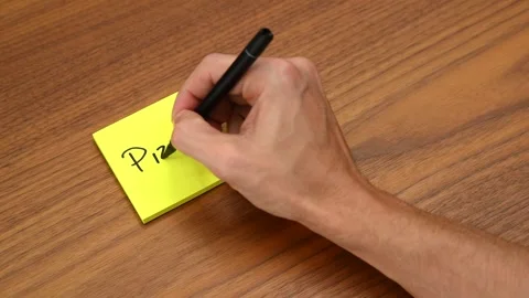 Hand Writing 'Pizza' on Sticky Note Stock Footage 328331371