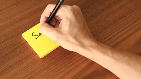 Hand Writing 'See Ya!' on Sticky Note Stock Footage 328331355