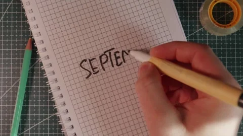 Hand writing September 1 date in school notebook Stock Footage 341269372