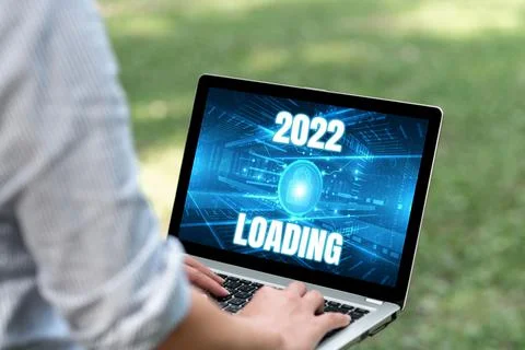 Hand writing sign 2022 Loading. Word for Advertising the upcoming year Stockfoto's