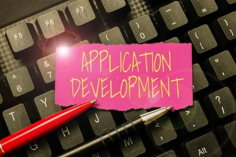 Hand writing sign Application Development. Word Written on creation of Computer Stock Photos