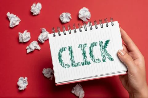 Hand writing sign Click. Concept meaning Act of pressing a button on a mouse Stock Photos