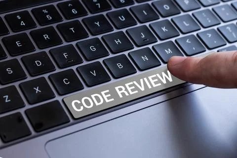 Hand writing sign Code Review. Business idea going over a subject in study or 写真素材