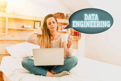 Hand writing sign Data Engineering. Business idea data science that focuses on Stock Photos