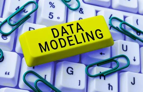 Hand writing sign Data Modeling. Word for process of transferring data between Stock Photos