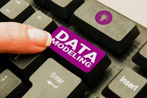 Hand writing sign Data Modeling. Business approach process of transferring data Stock Photos