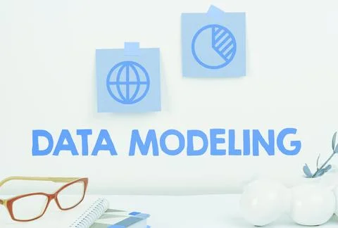 Hand writing sign Data Modeling. Business concept process of transferring data Stock Photos