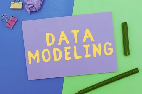 Hand writing sign Data Modeling. Business concept process of transferring data Stock Photos