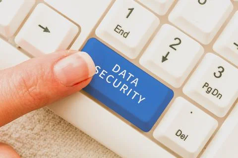 Hand writing sign Data Security. Business approach Confidentiality Disk Stock Photos