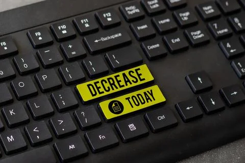 Hand writing sign Decrease. Concept meaning make or become smaller or fewer in Stock Photos