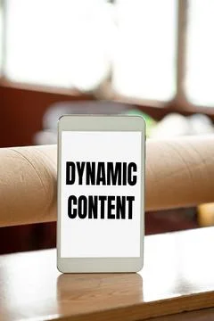 Hand writing sign Dynamic Content. Word for web content that changes based on Stock Photos