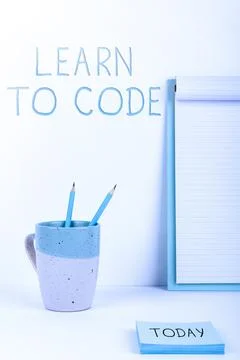 Hand writing sign Learn To Code. Concept meaning Learn to write Software Be a Stockfoto's