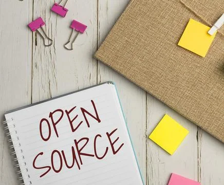 Hand writing sign Open Source. Internet Concept contains the source code that Stock Photos