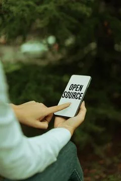 Hand writing sign Open Source. Business approach denoting software which Stockfoto's