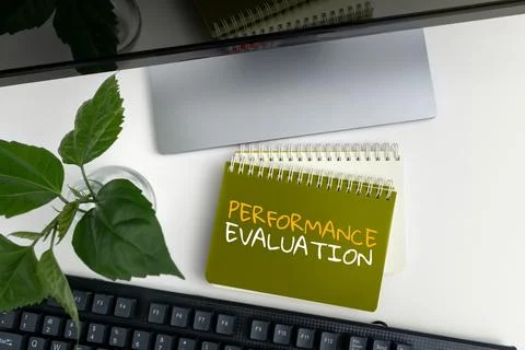 Hand writing sign Performance Evaluation. Word Written on the development and Stock Photos