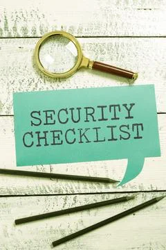 Hand writing sign Security ChecklistProtection of Data and System Guide on Stock Photos