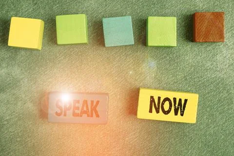 Hand writing sign Speak Now. Word Written on Communicate to us your feelings and 스톡 사진