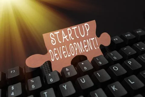 Hand writing sign Startup Development. Conceptual photo efficiently develop and Stock Photos