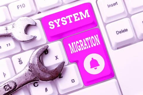 Hand writing sign System Migration. Word Written on moving from the use of one Photos