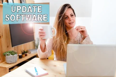 Hand writing sign Update Software. Business overview replacing program with a Foto stock
