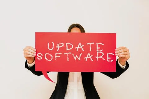 Hand writing sign Update Softwarereplacing program with a newer version of same Stock Photos