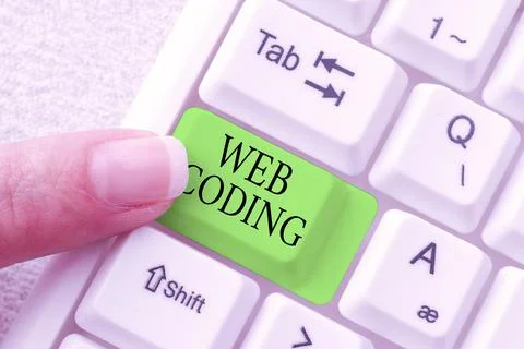 Hand writing sign Web Coding. Business showcase work involved in developing a Stockfoto's