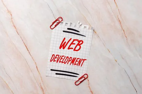 Hand writing sign Web Development. Word Written on work involved in developing a Stock Photos