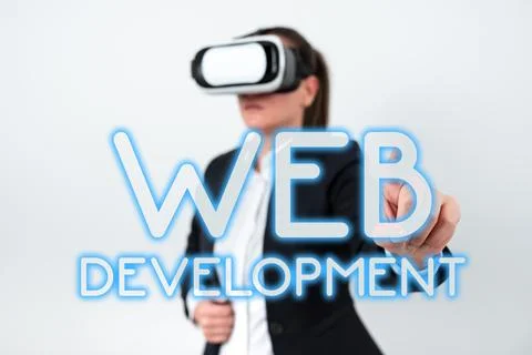 Hand writing sign Web Development. Word Written on work involved in developin Stock Photos