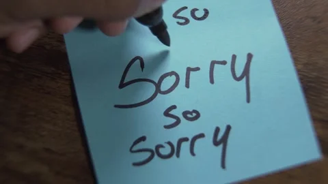 Hand writing sincere apology note with hearts Stock Footage 319344812
