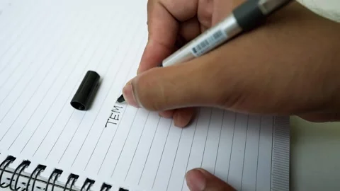 Hand Writing in Spiral Notebook Close-Up Stock Footage 318578329
