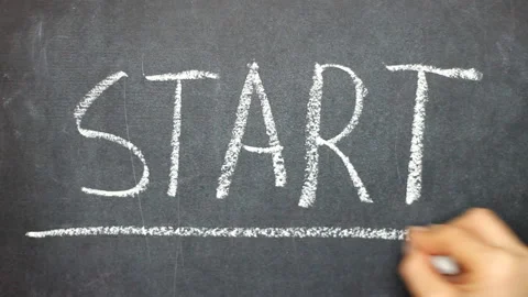 Hand writing START on chalkboard using chalk. Stock Footage 141142412