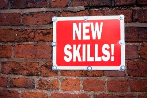 Hand writing text caption inspiration showing New Skills concept meaning Educ Stock Photos