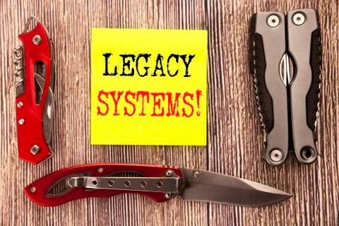 Hand writing text caption inspiration showing Legacy Systems. Business concep Stock Photos
