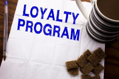 Hand writing text caption showing Loyalty Program. Business concept for Marke Stock Photos