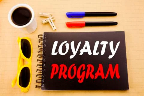 Hand writing text caption showing Loyalty Program. Business concept for Marke Stock Photos