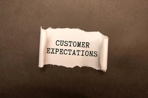 Hand writing the text: Customer Expectations. Stock Photos