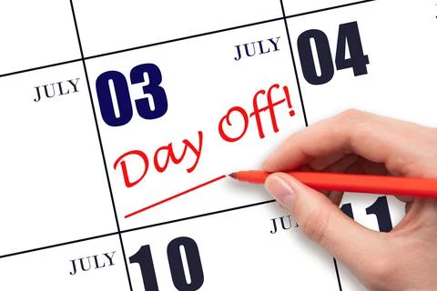 Hand writing text DAY OFF and drawing a line on calendar date 3 July. Vacatio Stock Photos