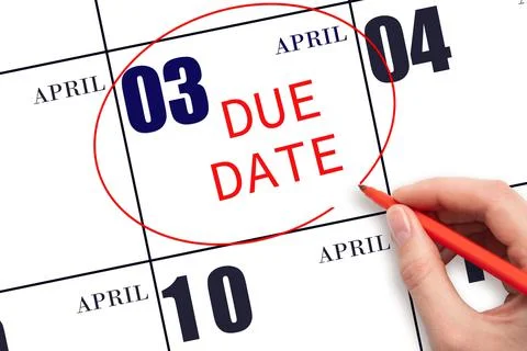 Hand writing text DUE DATE on calendar date April 3 and circling it. Payment  Stock Photos