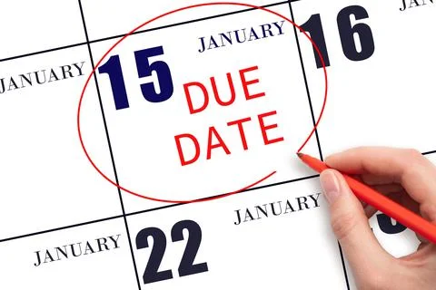 Hand writing text DUE DATE on calendar date January 15 and circling it. Payme Stock Photos