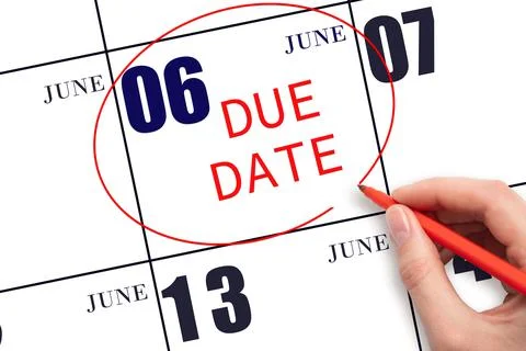 Hand writing text DUE DATE on calendar date June 6 and circling it. Payment d Stock Photos