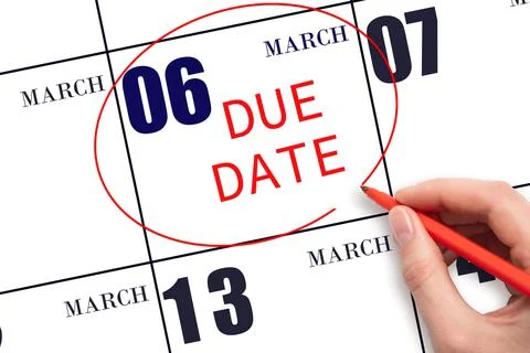 Hand writing text DUE DATE on calendar date March 6 and circling it. Payment  Stock Photos