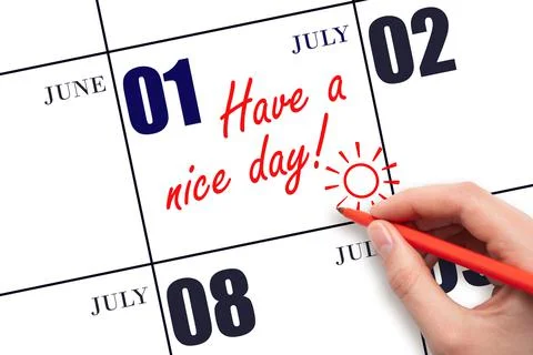 The hand writing the text Have a nice day and drawing the sun on the calendar Stock Photos