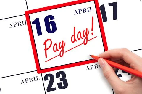 Hand writing text PAY DATE on calendar date April 16 and underline it. Paym.. Stock Photos
