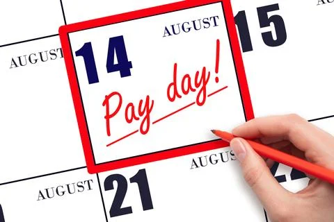 Hand writing text PAY DATE on calendar date August 14 and underline it. Pay.. Stock Photos