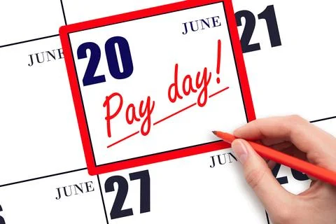Hand writing text PAY DATE on calendar date June 20 and underline it. Payme.. Stock Photos