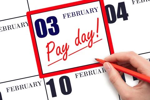 Hand writing text PAY DATE on calendar date February 3 and underline it. Pa.. Stock Photos