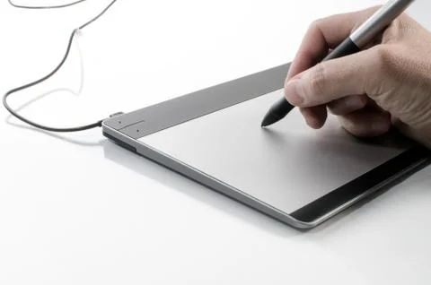 Hand writing on a touch pad Stock Photos