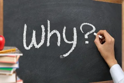 Hand writing why question on a blackboard Foto stock