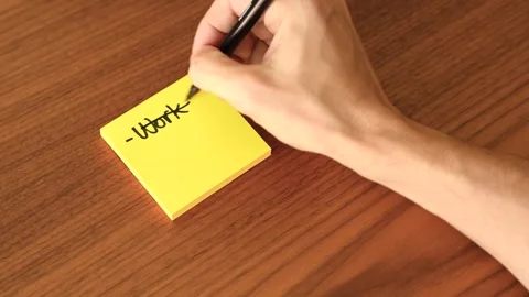 Hand Writing 'Work-Relax' on Sticky Note Stock Footage 328331465
