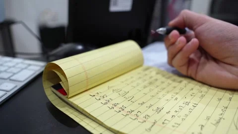 Hand Writing On Yellow Notepad At Office Desk Stock Footage 337701529